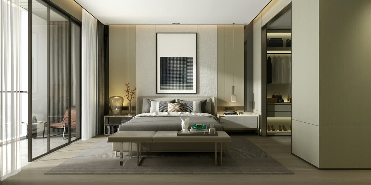 Calm luxury bedroom with panelled walls and soft neutral paint, decorated in a Repton home